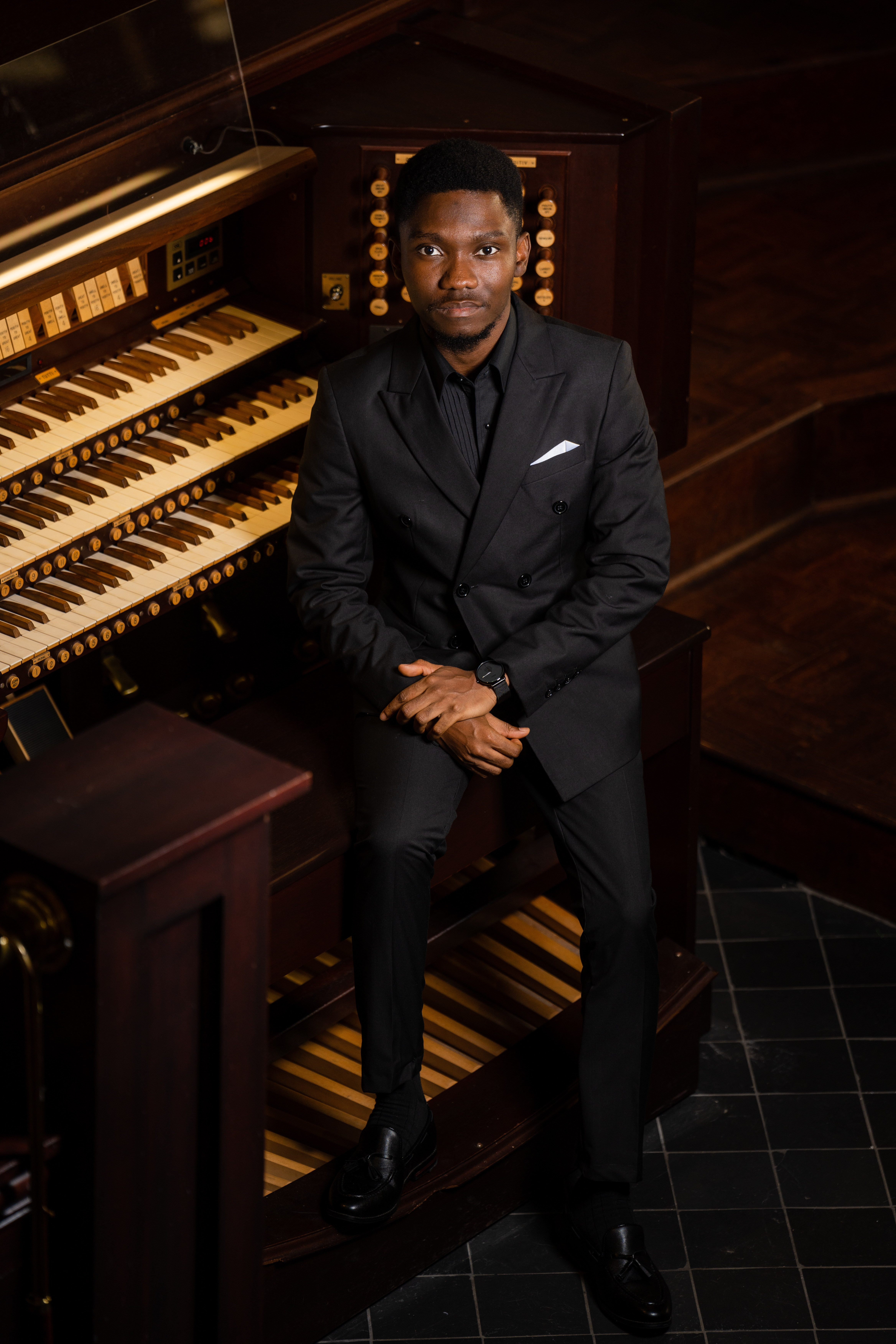 Kwamena Amissah seated at the organ console